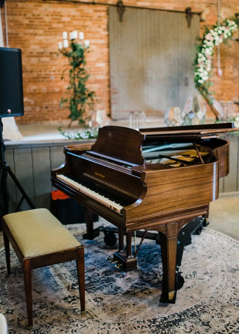 Baby grand piano at a wedding at Empire Mills in Madison, Georgia.